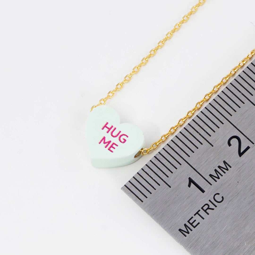 Gold Dipped Heart Candy Necklace layered in warm coastal boho charm