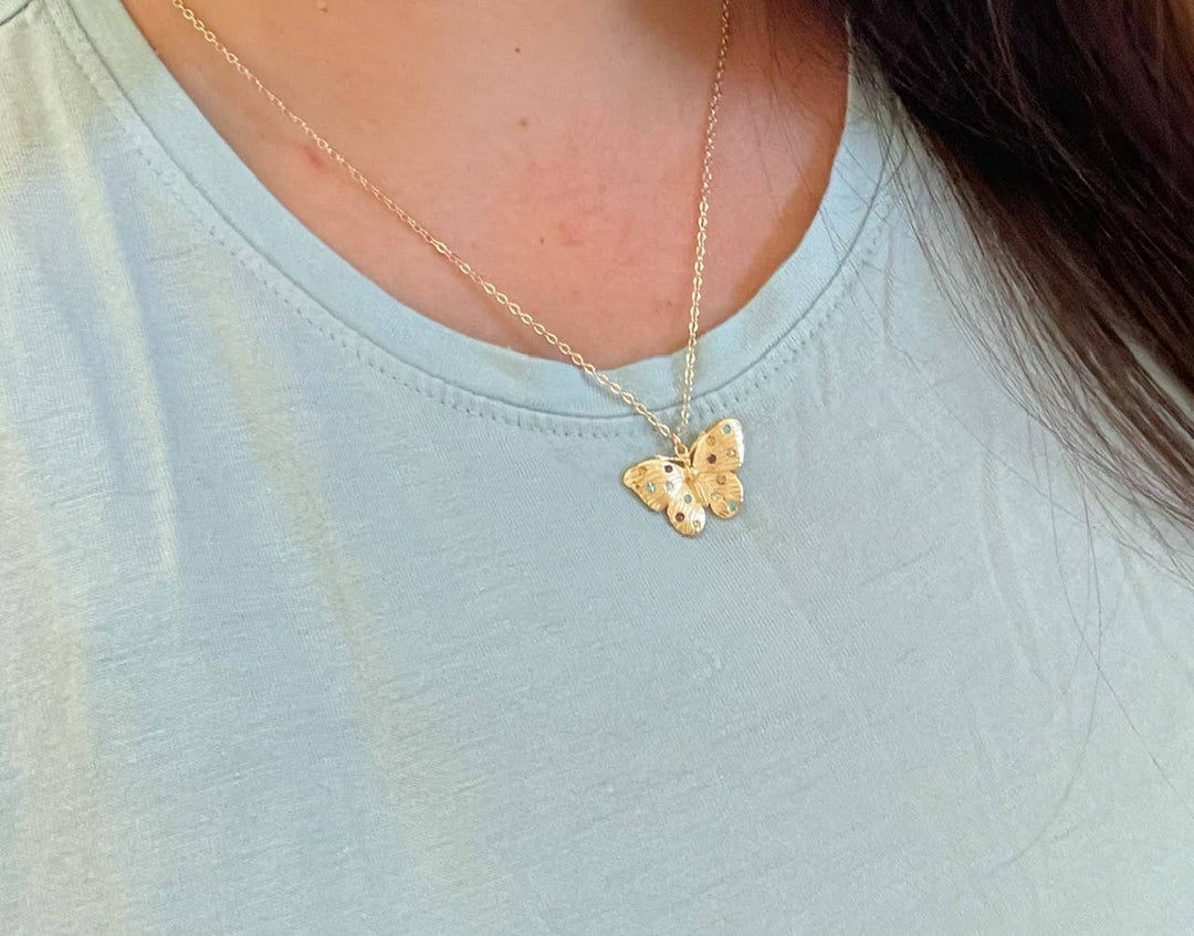 Dainty gold anchor layering necklace with butterfly charm coastal minimalist jewelry