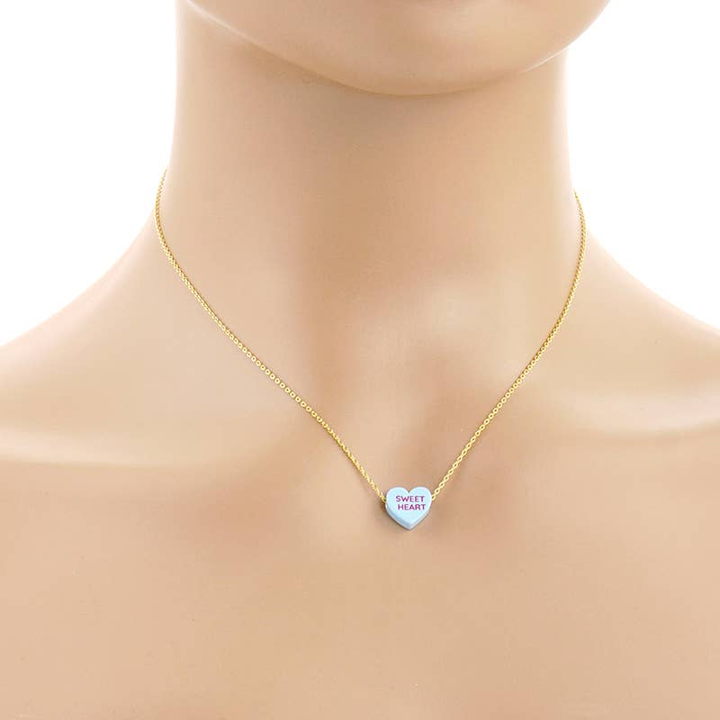 Gold Dipped Heart Candy Necklace layered with coastal charm and boho sweetness