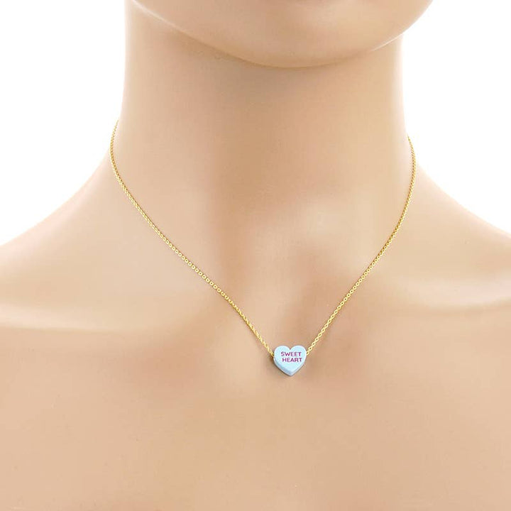 Gold Dipped Heart Candy Necklace layered with coastal charm and boho sweetness