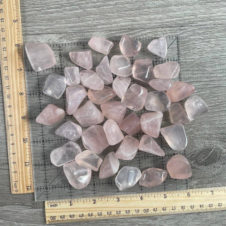 Rose quartz tumbled stones bulk lot glowing with soft heart chakra energy