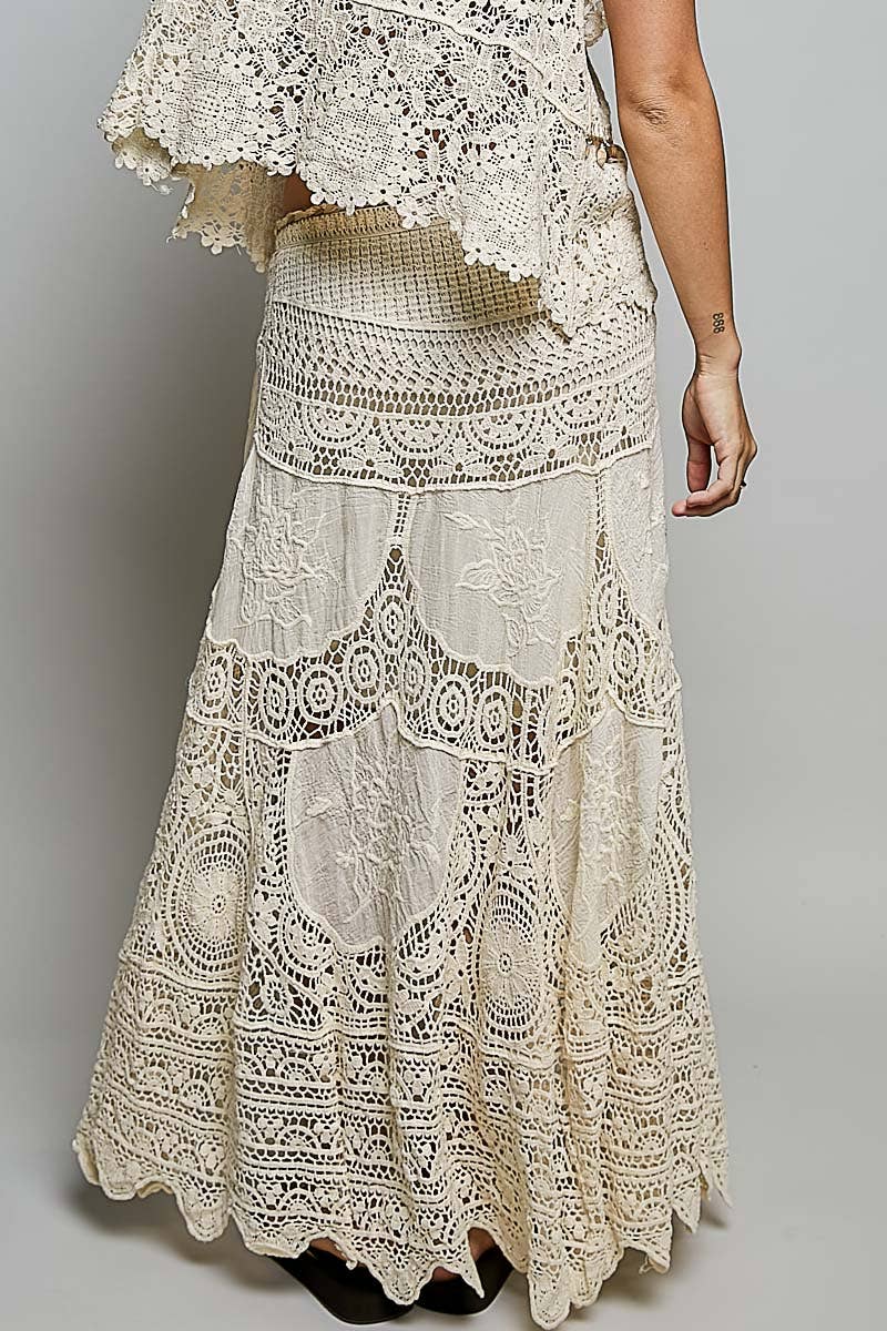 Flowing crochet embroidered maxi skirt in earthy tones for boho coastal style