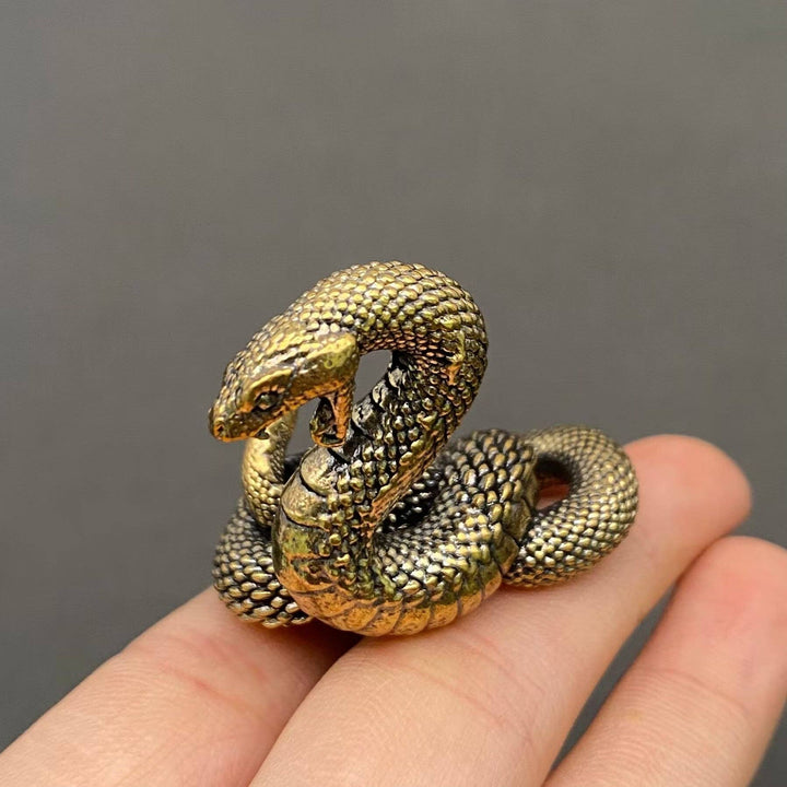 Brass Python Snake Desktop Ornament symbolizing resilience and transformation for sacred coastal spaces