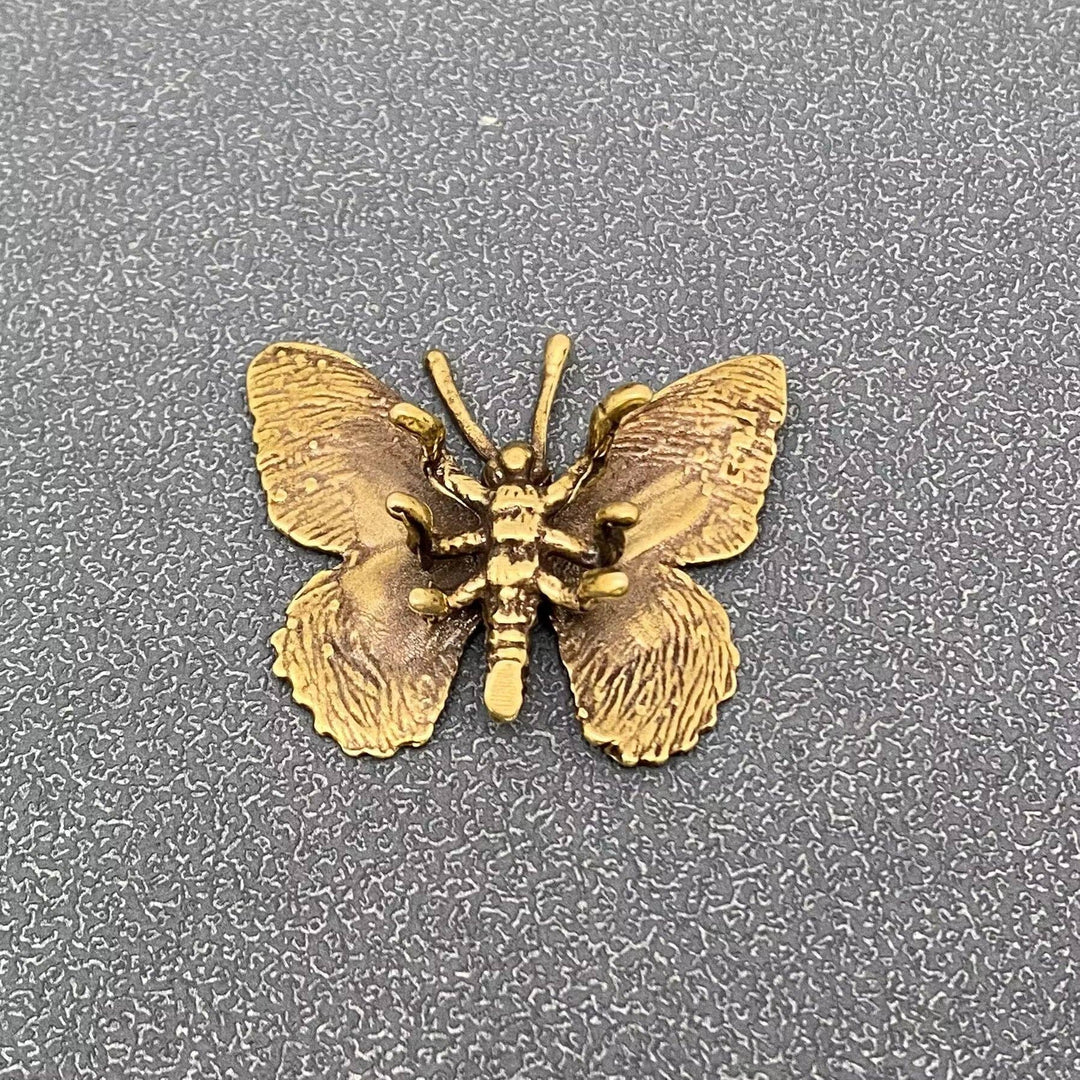 Vintage brass butterfly desktop ornaments symbolizing transformation for a coastal sacred space
