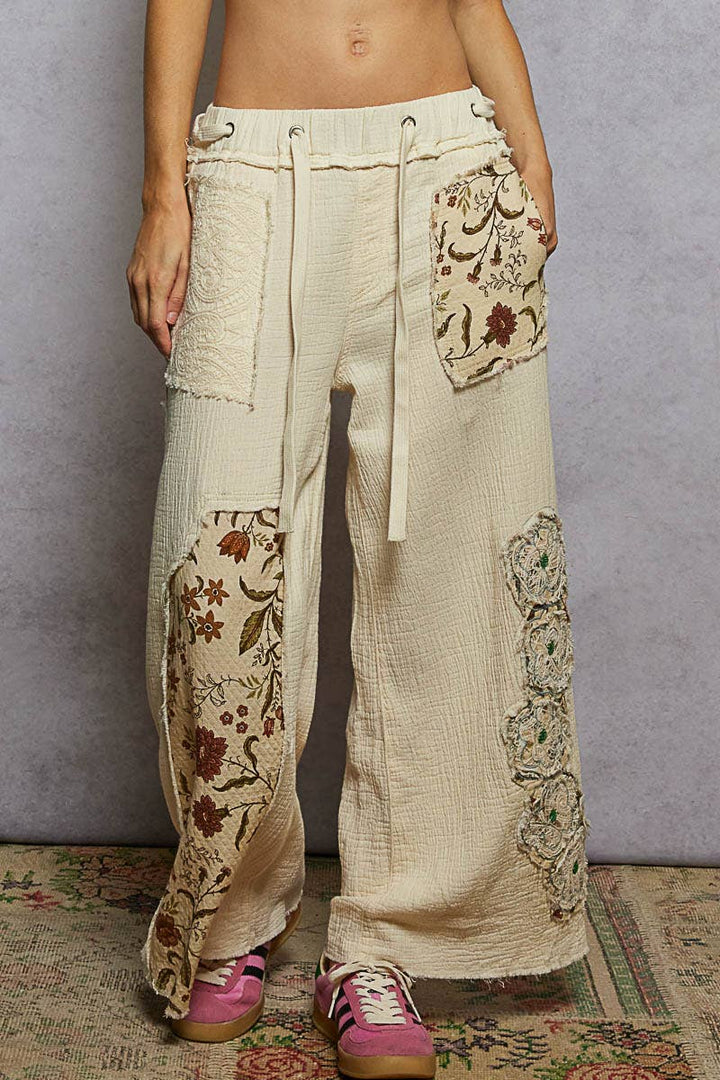 Double gauze floral patches detail woven pants in natural coastal boho style
