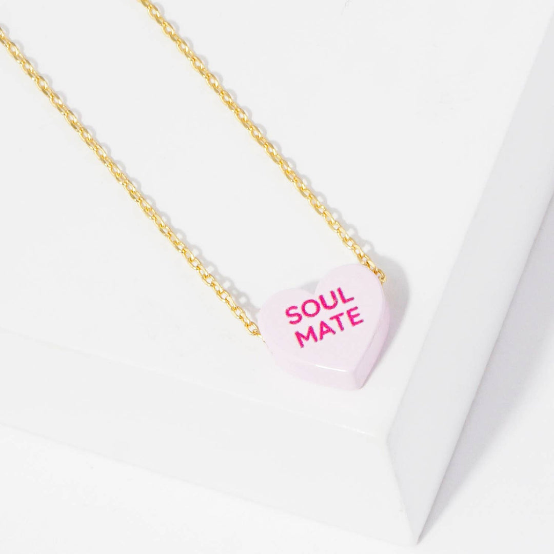 Gold Dipped Heart Candy Necklace layered with coastal charm and handcrafted warmth