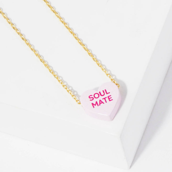Gold Dipped Heart Candy Necklace layered with coastal bohemian charm and sweetness