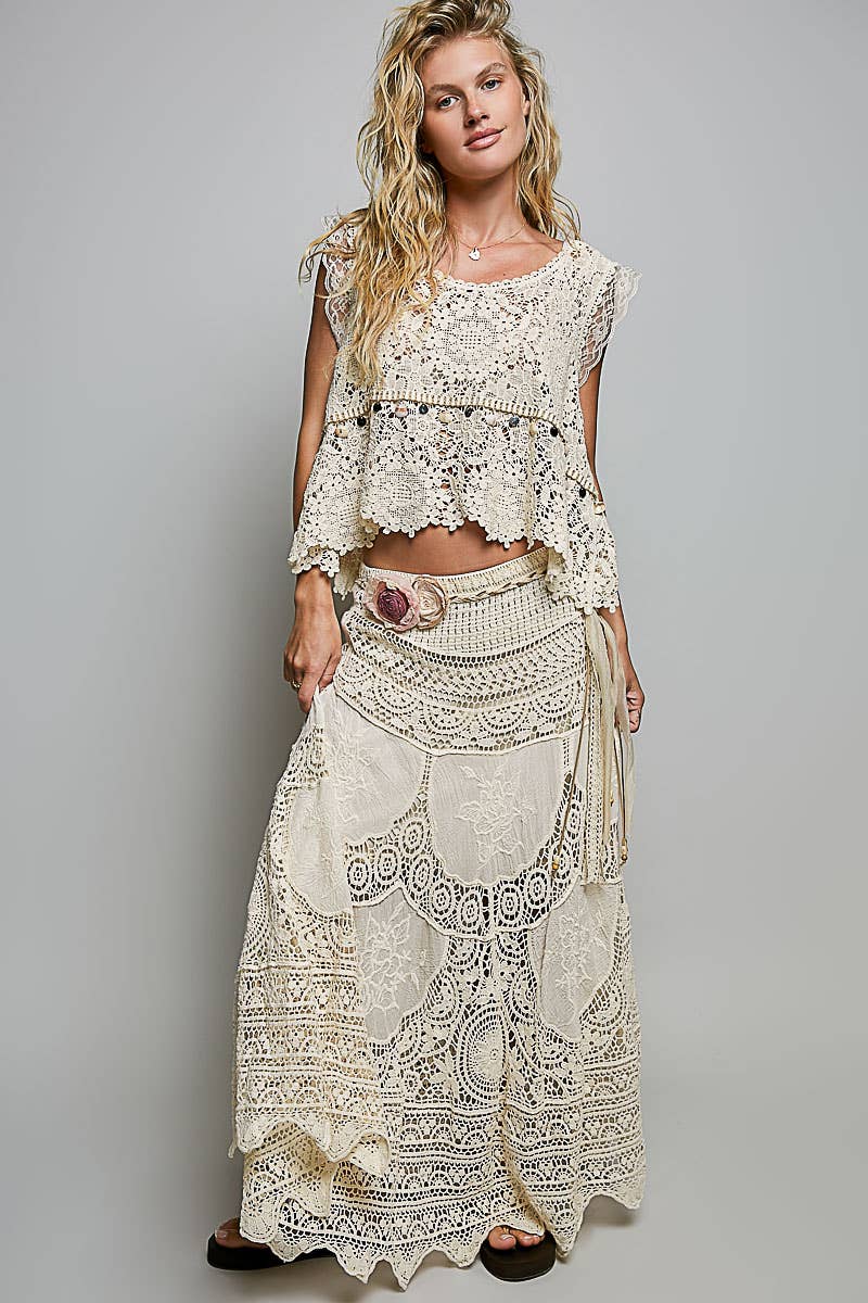 Flowing crochet embroidered maxi skirt in earthy tones for coastal boho style