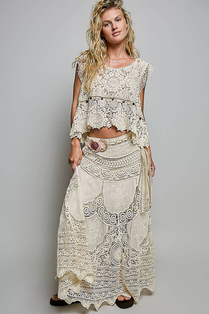 Flowing crochet embroidered maxi skirt in earthy tones for coastal boho style