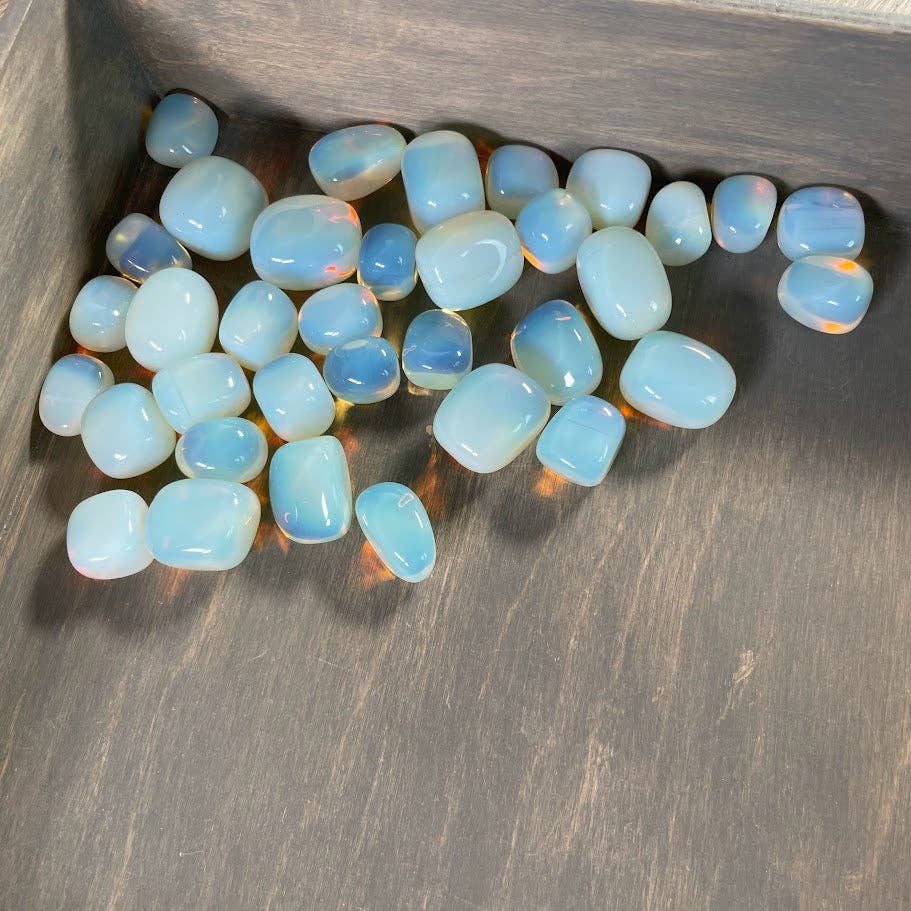 Opalite tumbled stones bulk lot glowing with soft moonlit iridescent energy