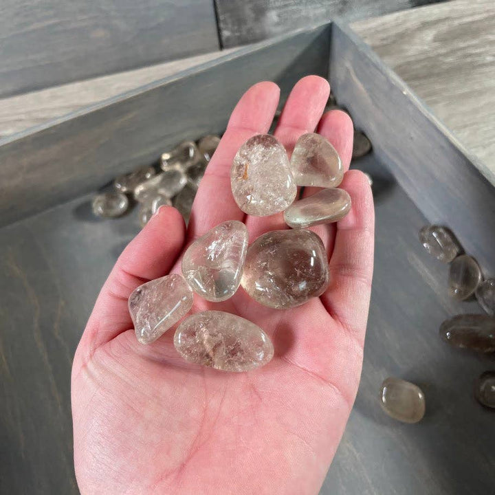 Smoky quartz tumbled stones bulk wholesale for grounding crystal grids and coastal spiritual spaces
