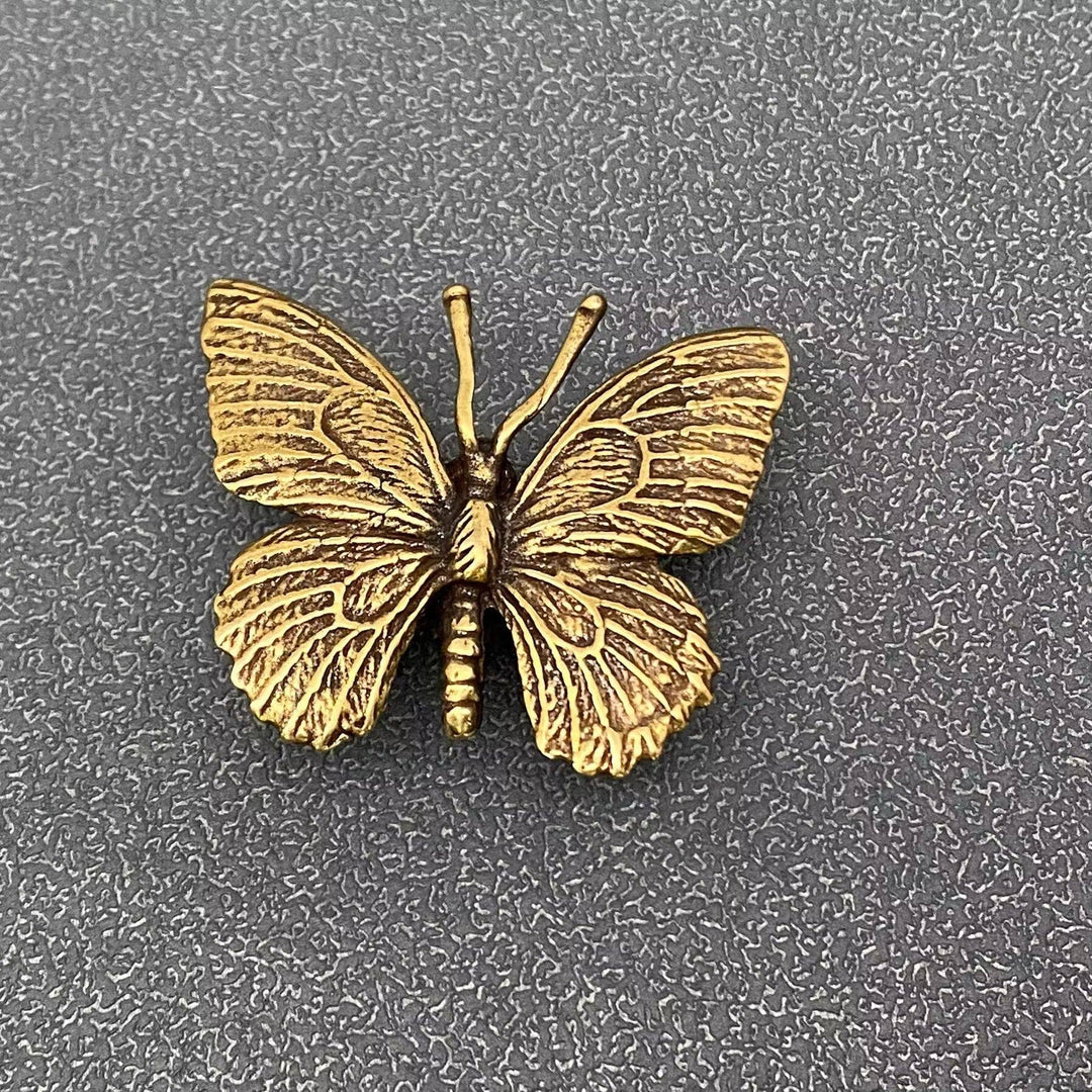 Vintage brass butterfly desktop ornaments for transformation and sacred coastal living spaces