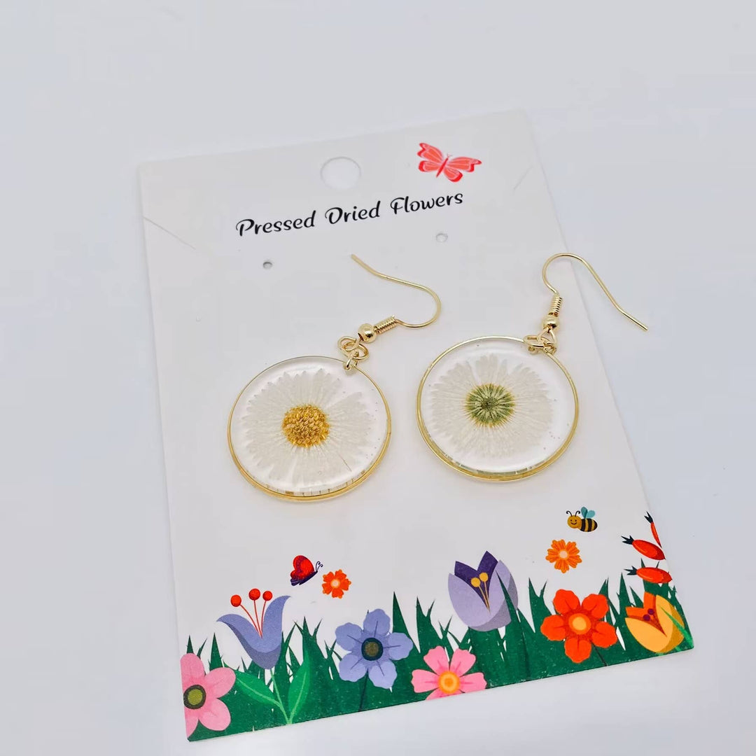 Leucanthemum Paludosum dried flower circular earrings handcrafted for a coastal bohemian spirit
