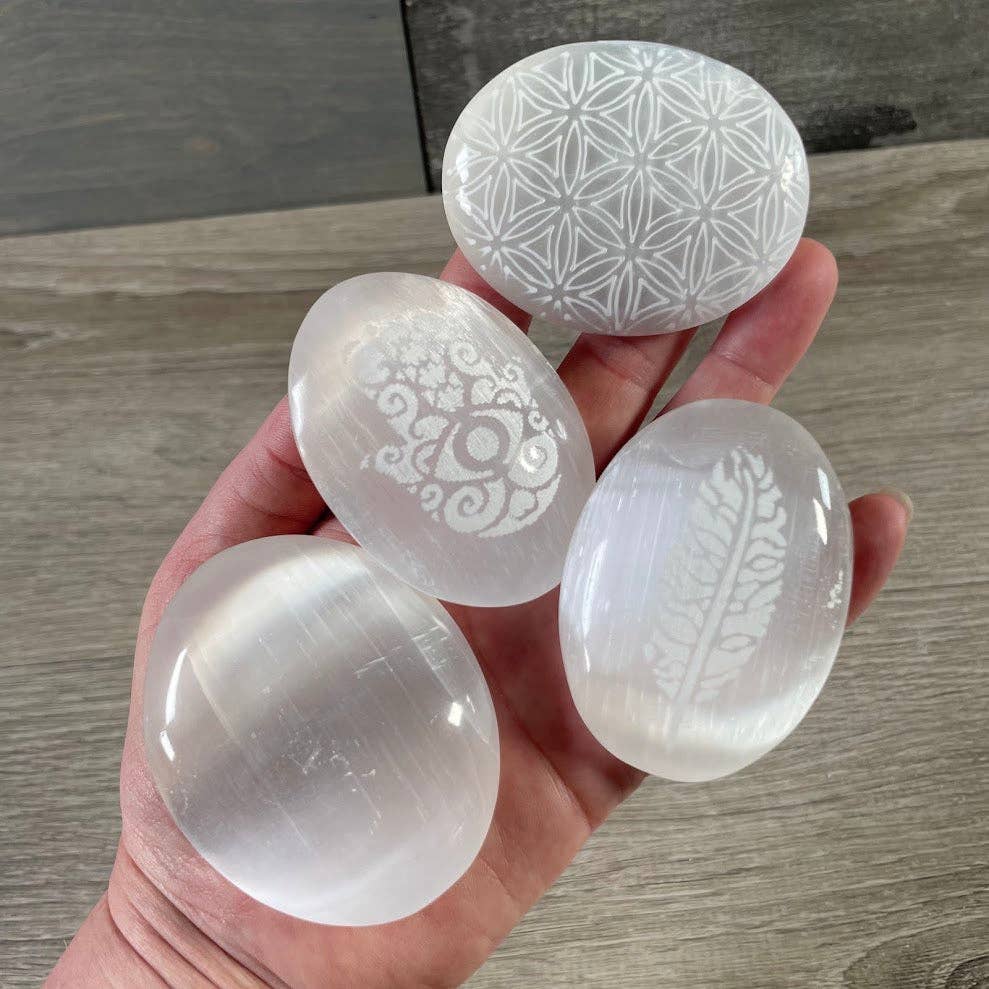 Selenite Palm Stone with engraved Hamsa for energy healing and spiritual wellness