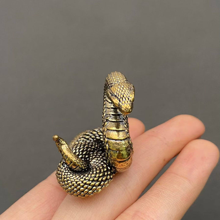 Brass python snake desktop ornament symbolizing resilience and transformation for sacred boho spaces