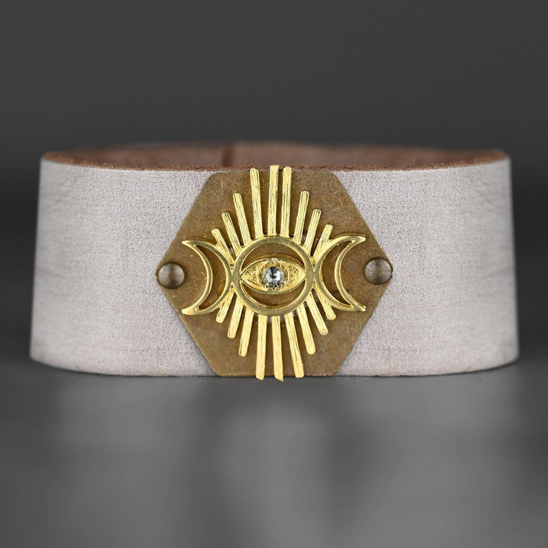 Distressed vintage cream leather cuff bracelet with crescent moon evil eye and stone