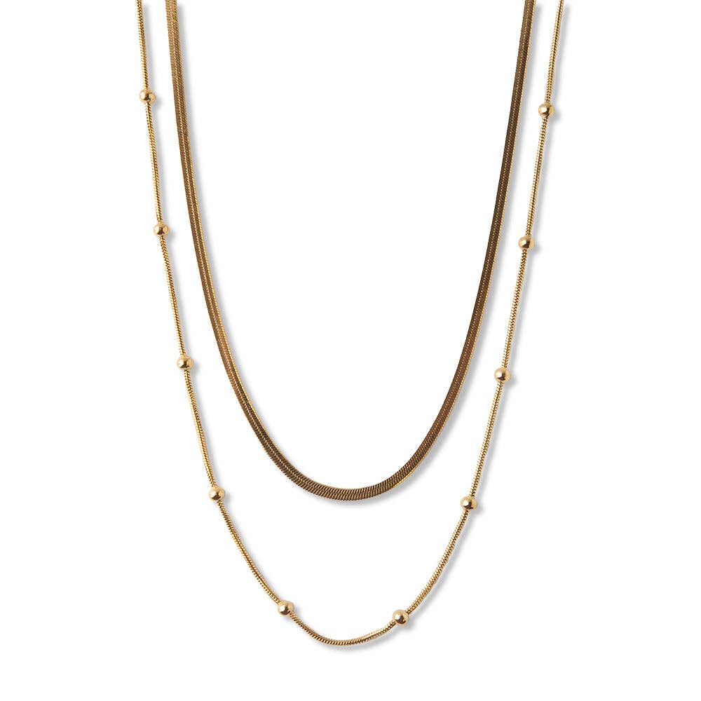 Gold chain layered necklace with herringbone and satellite chains for coastal boho style
