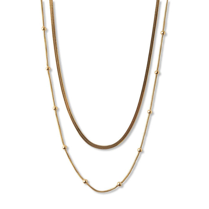 Gold chain layered necklace with herringbone and satellite chains for coastal boho style