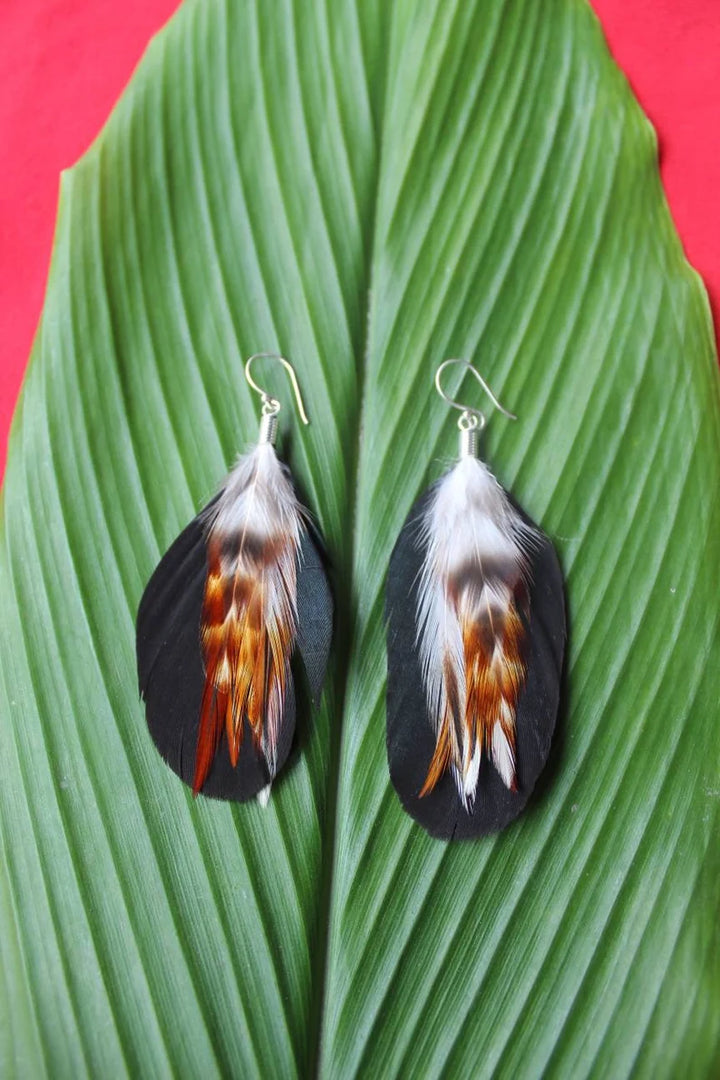 Handmade Bali feather earrings in black and purple from Anchored Soul boutique