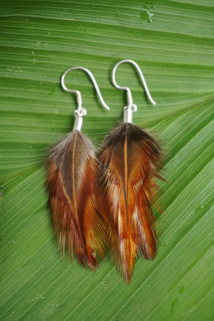 Handmade Bali feather earrings in brown white and pink boho coastal style