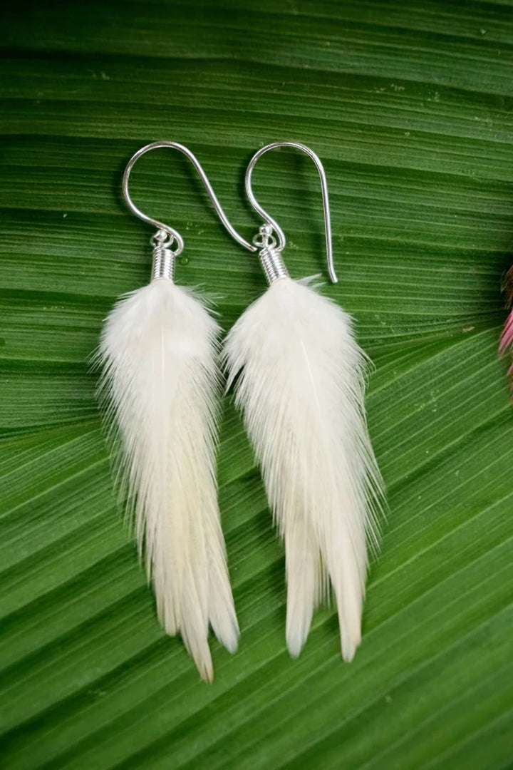 Handmade Bali feather earrings in brown white and pink boho coastal style