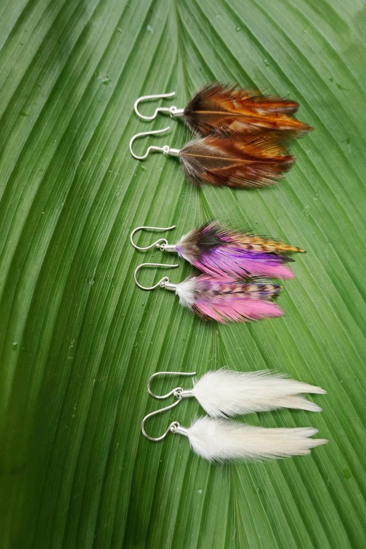 Handmade Bali feather earrings in brown white and pink boho coastal style