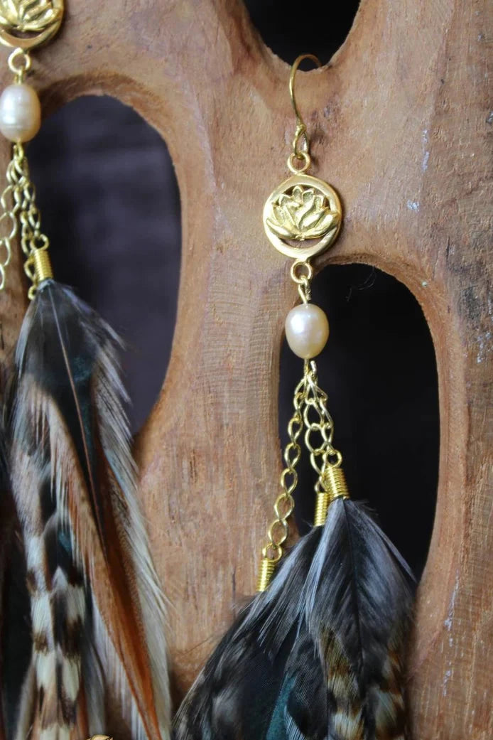 Handmade Bali feather earrings in brown and green with a lotus-inspired design