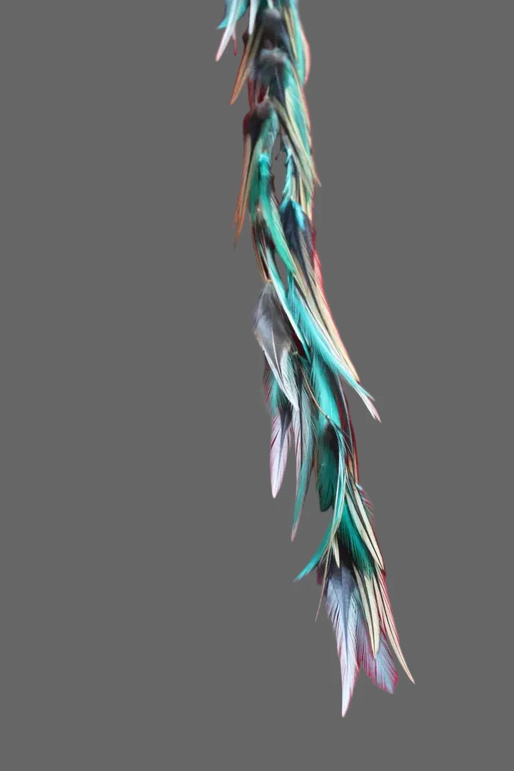 Handmade Bali feather hair clip in brown purple and green boho coastal style