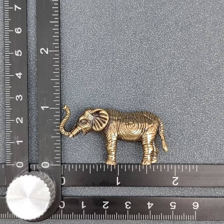 Brass elephant desktop ornament bringing good luck and grounding energy to boho spaces