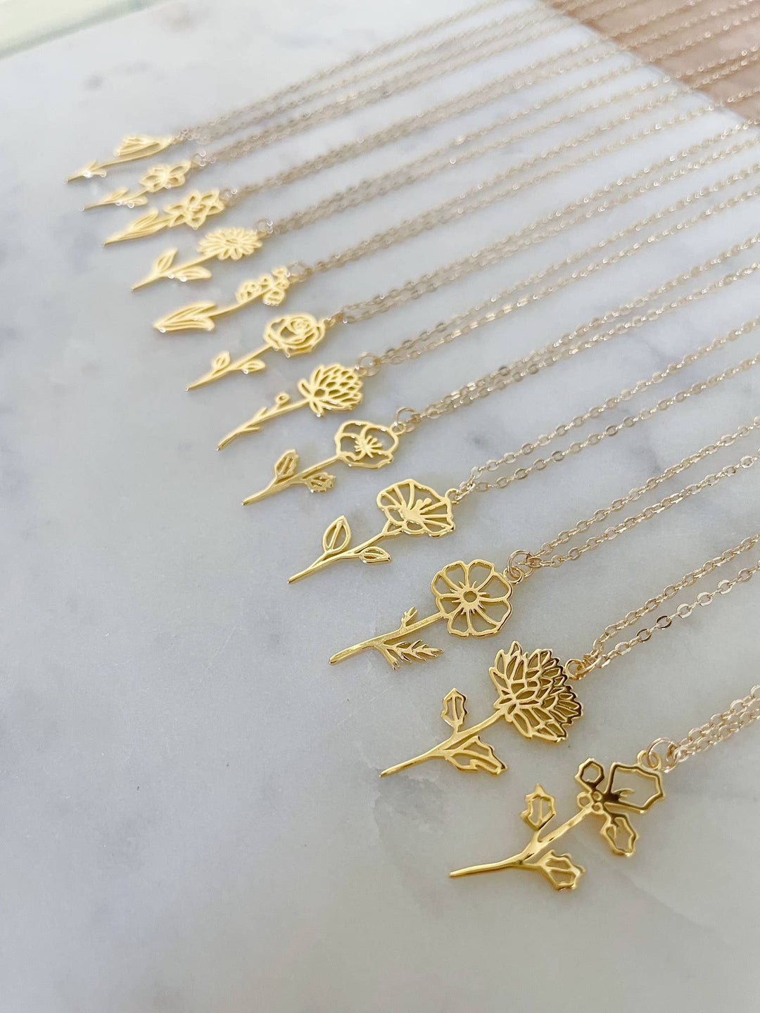 Gold July birth flower necklace featuring a delicate water lily for summer birthdays