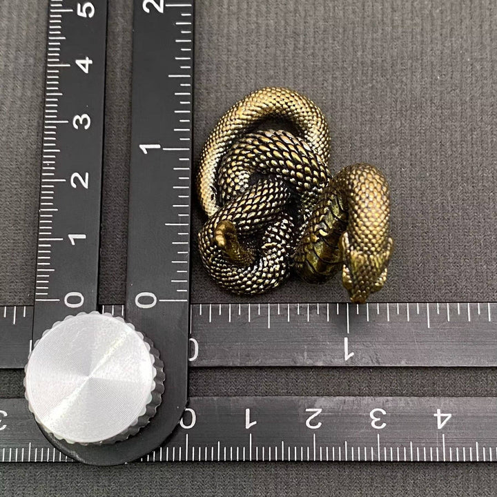 Brass python snake desktop ornament symbolizing resilience and transformation for sacred boho spaces