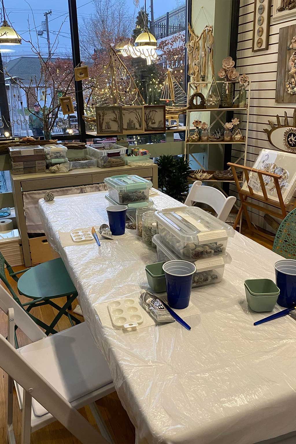 Table with supplies and containers in a store setting
