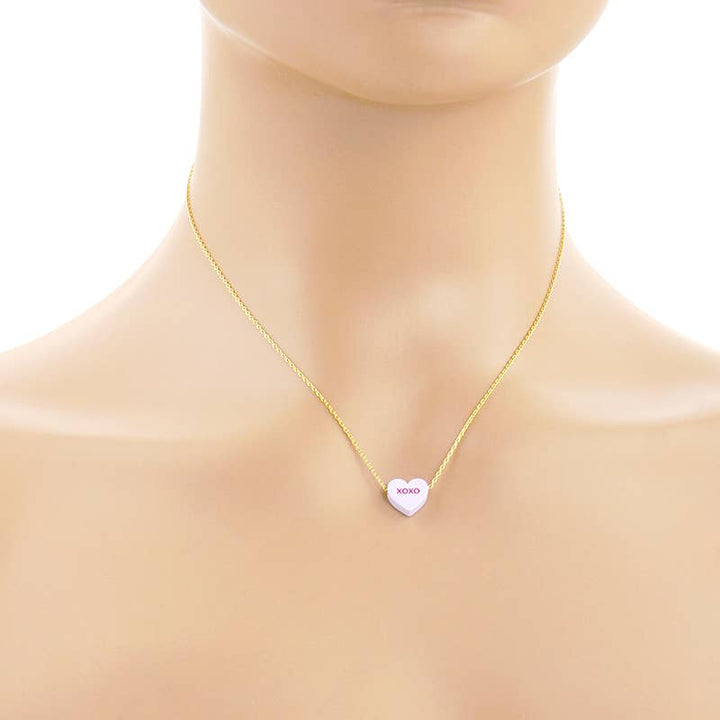 Gold Dipped Heart Candy Necklace layered in warm coastal charm and soulful style