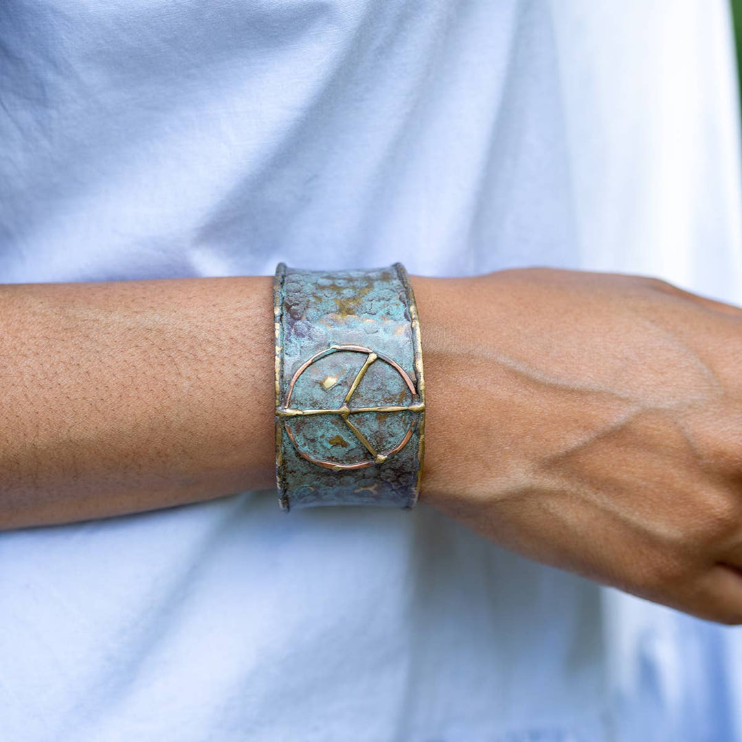 Brass Patina Cuff Bracelet in rustic blue with a handcrafted peace sign detail
