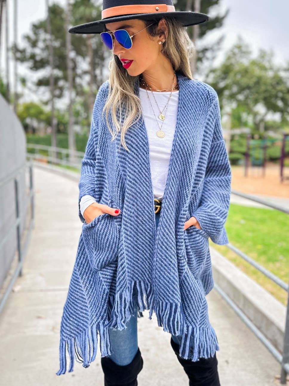 Navy chevron knitted ruana cardigan with tassel and pocket for coastal bohemian style