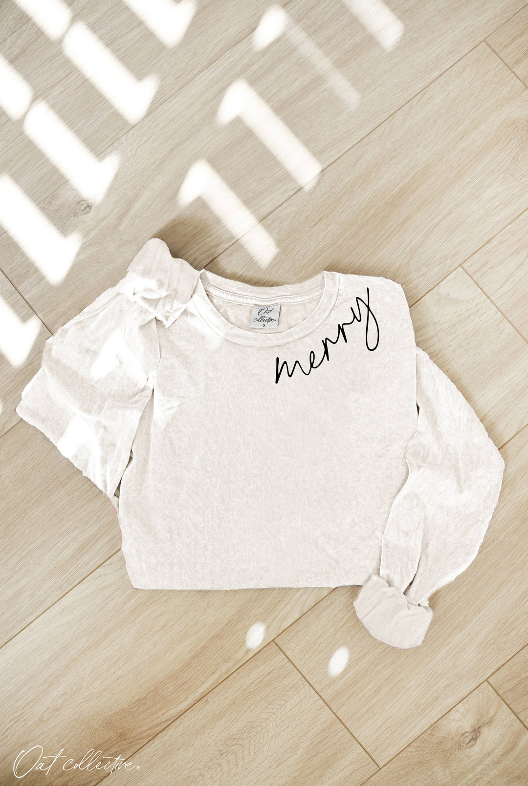 MERRY mineral washed long sleeve graphic tee with relaxed boho coastal style