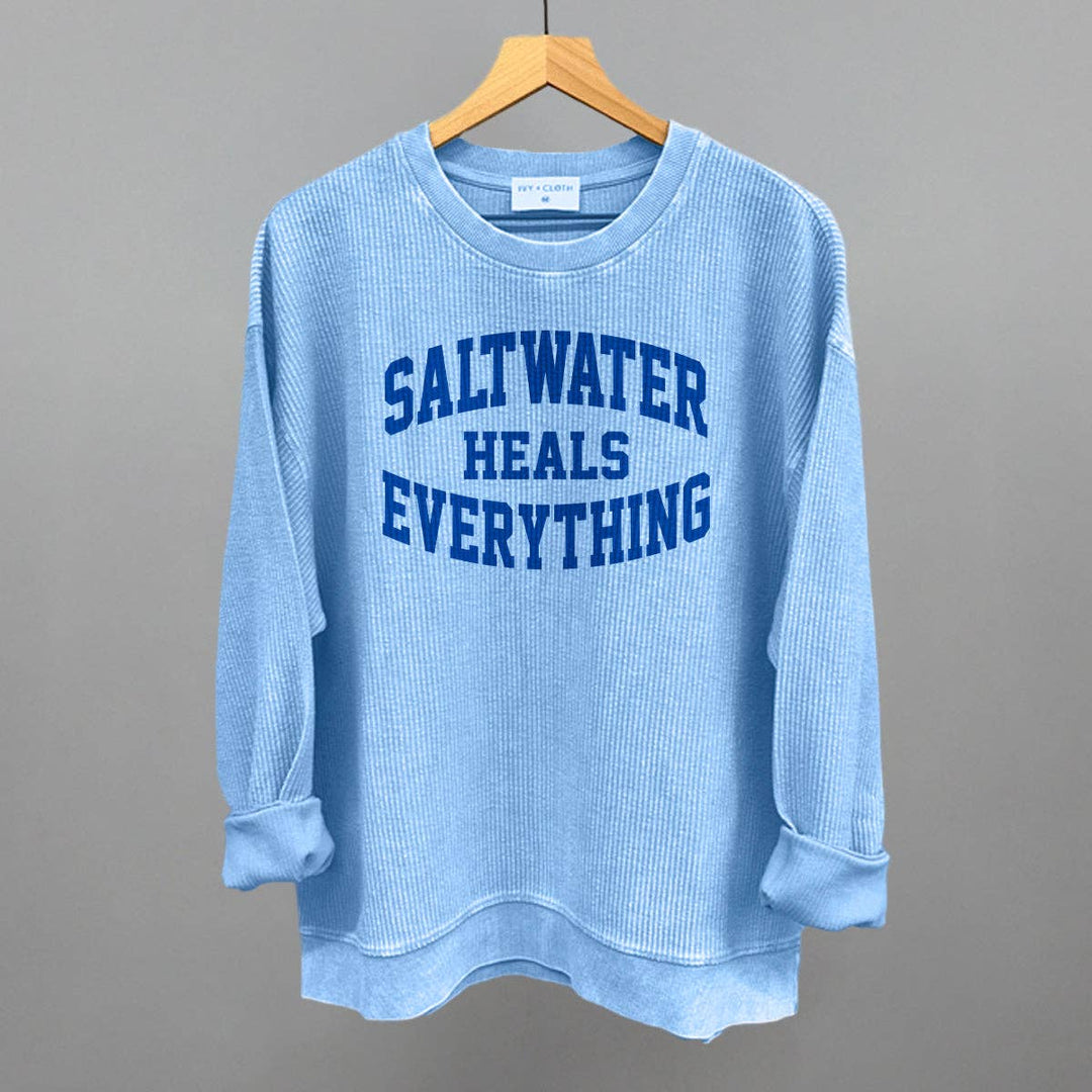 Saltwater Heals Everything Sweatshirt with coastal boho graphic for beach lovers