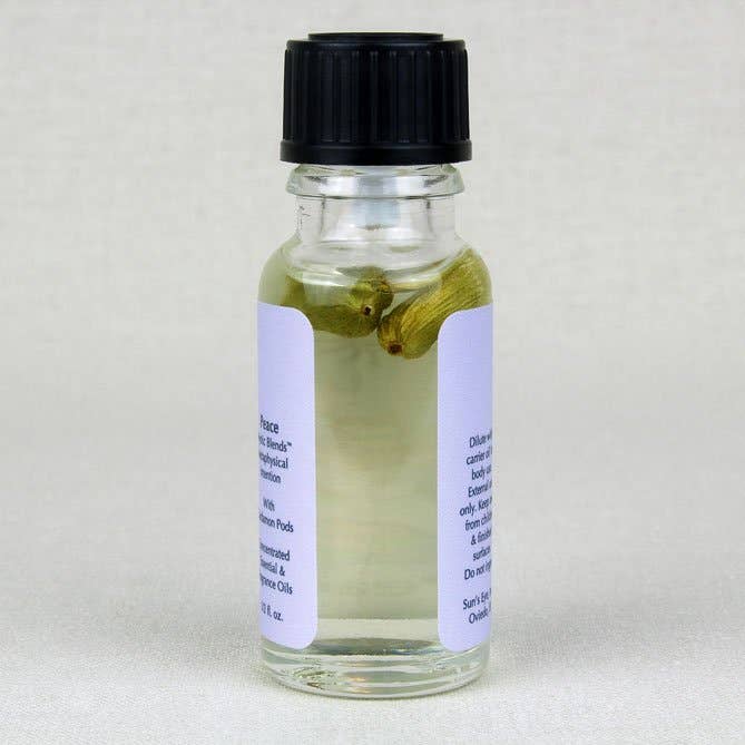 Peace Essential Oil small amber bottle with calming violet cardamom blend for holistic wellness