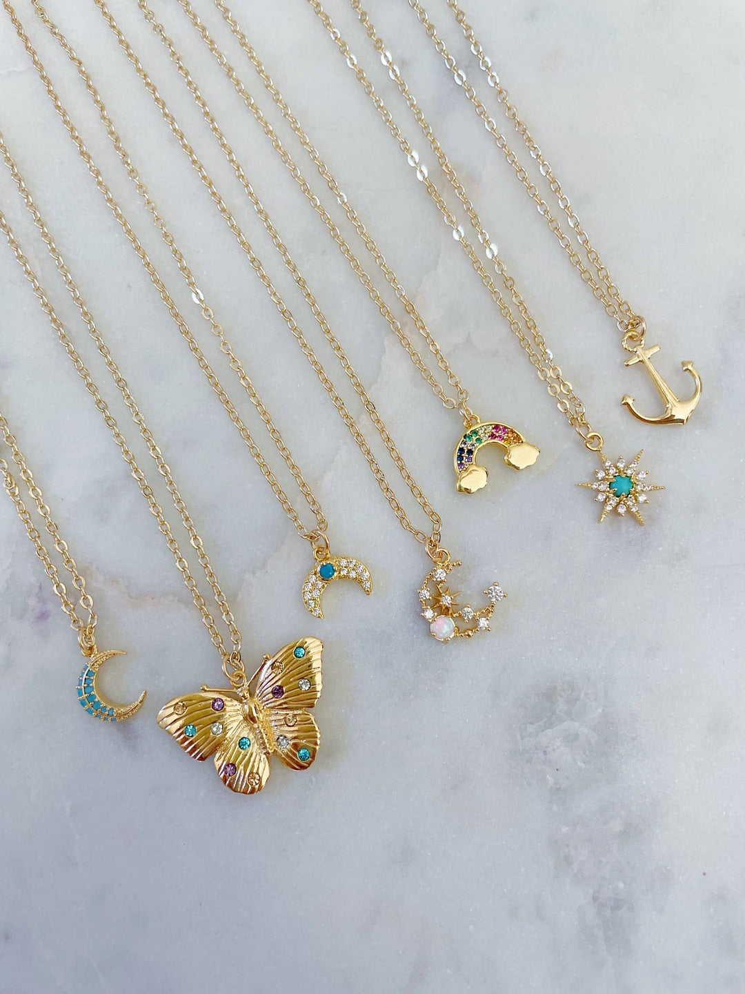 Dainty gold anchor layering necklace with butterfly charm minimalist coastal jewelry