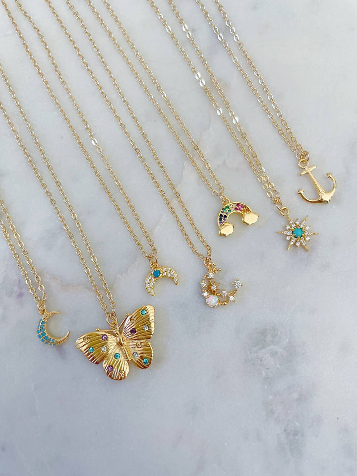 Dainty gold anchor layering necklace with butterfly charm minimalist coastal jewelry