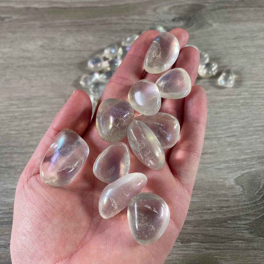 Angel Aura Quartz Tumbled Stones bulk bag shimmering with rainbow iridescent energy